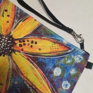 Zippered linen wristlet with artistic yellow daisy floral design