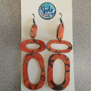 Mod, orange starburst, lightweight statement earrings