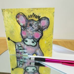 Square note card with a cow printed on the front