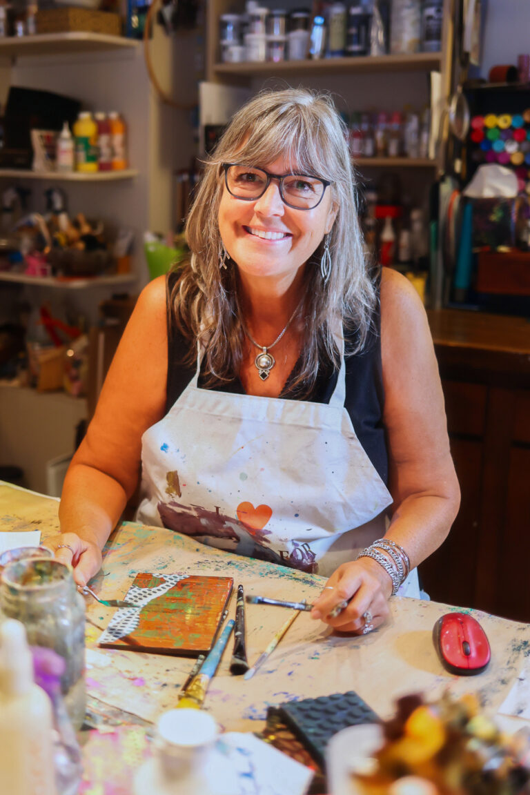 Photo of Patty Donahue in her painting studio