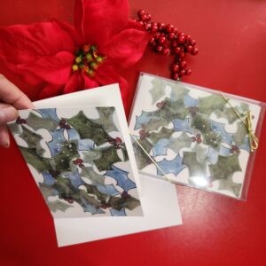 Watercolor Holly leaves imprinted on an A2 size holiday card that is blank inside for your personal message.