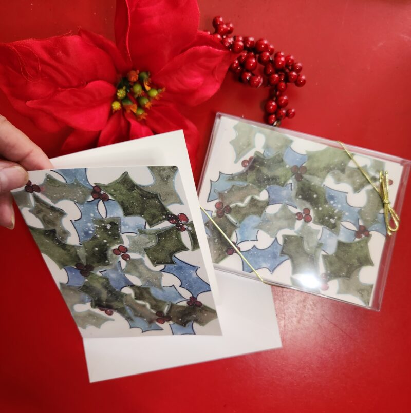 Watercolor Holly leaves imprinted on an A2 size holiday card that is blank inside for your personal message.