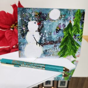 Winter Wonder - A2 size holiday greeting card with a snowman forest scene on the front. Patty Donahue artist